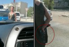 В Актау женщина попрошайничала прямо посреди дороги, угрожая игрушечным пистолетом