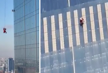 Гулявшего по фасаду здания Санта-Клауса засняли на видео в Астане