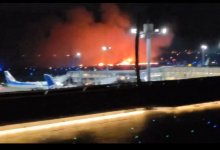 Самолет с пассажирами загорелся при посадке в аэропорту Токио